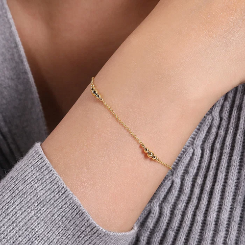 Graduating Bead Station Bracelet in 14K Yellow Gold